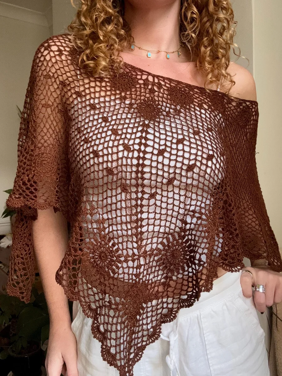 Brown version of the Clover Poncho layered over white clothing