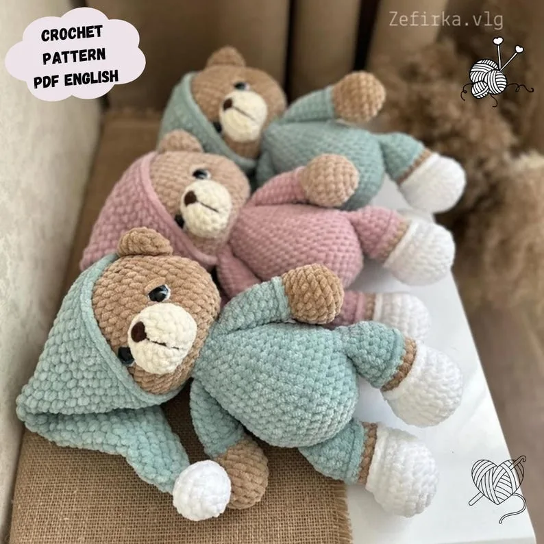 Three plush crochet teddy bears in mint and pink bedtime outfits